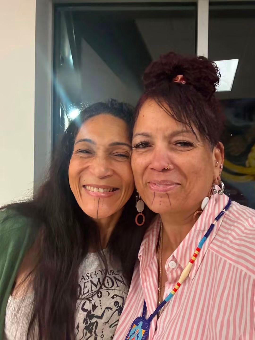 Two tribal members smiling together